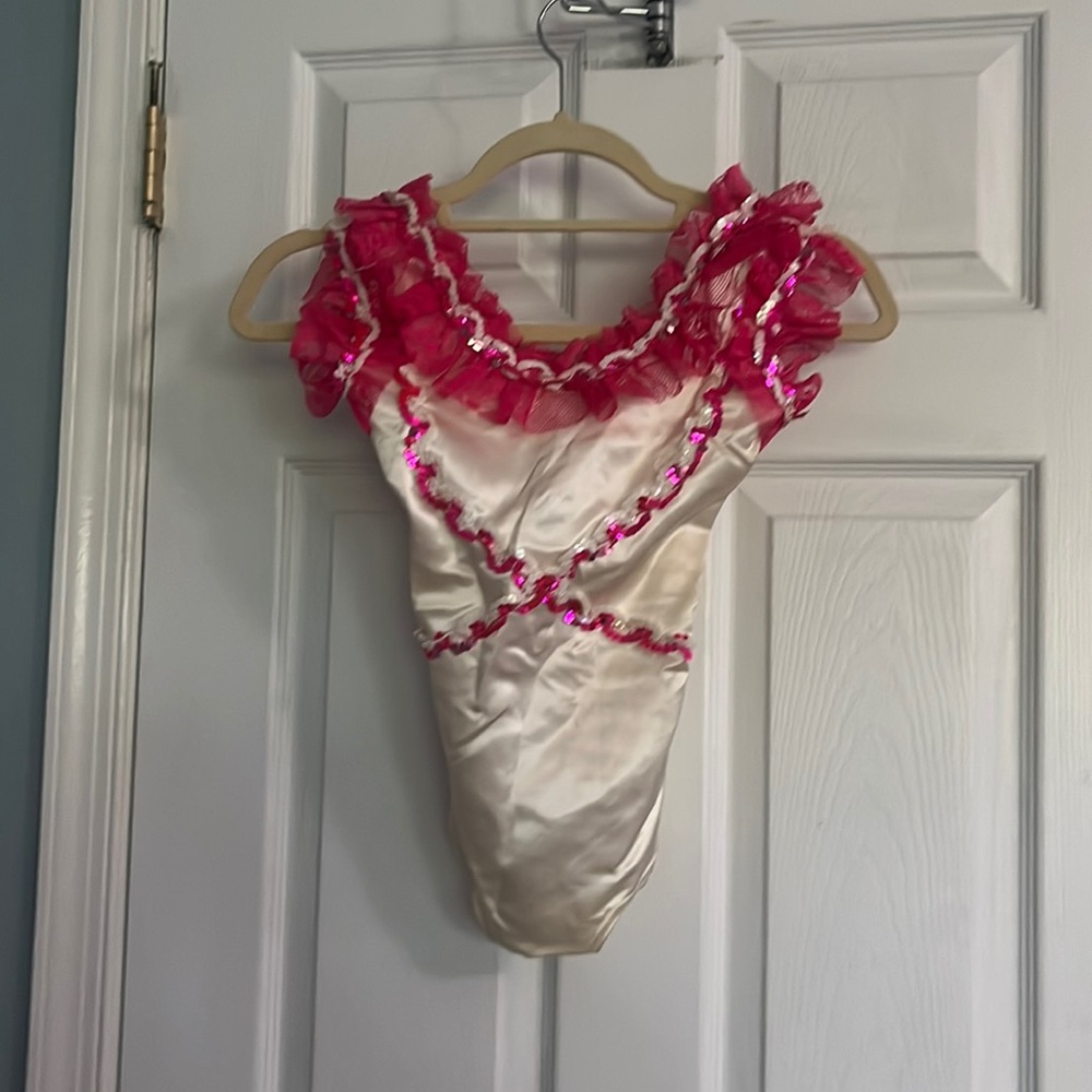 Pink and white sequined and lace leotard